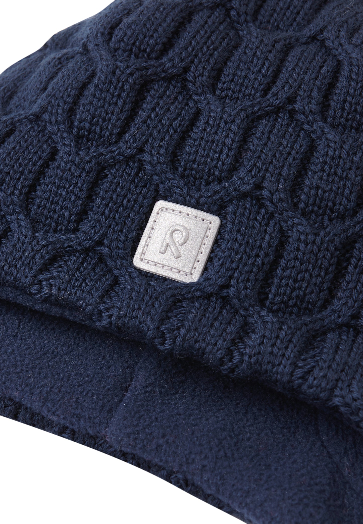 REIMA Mütze mit Bändel <br>Nunavut <br>Gr. 46 - 52 <br>innen hautfreundliches Fleece<br> aussen warme, wasserabweisende Merino-Wolle<br> Windstopper-Membrane im Ohrbereich