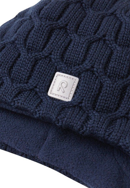 REIMA Mütze mit Bändel <br>Nunavut <br>Gr. 46 - 52 <br>innen hautfreundliches Fleece<br> aussen warme, wasserabweisende Merino-Wolle<br> Windstopper-Membrane im Ohrbereich